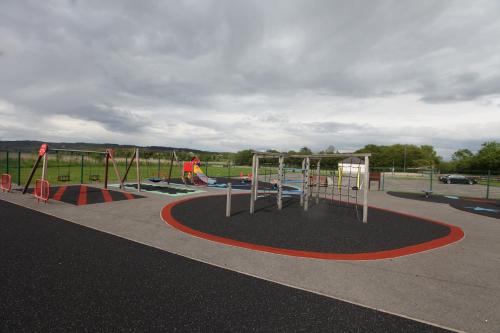 a park with a playground with a play equipment at John Joe's Self Catering in Blacklion