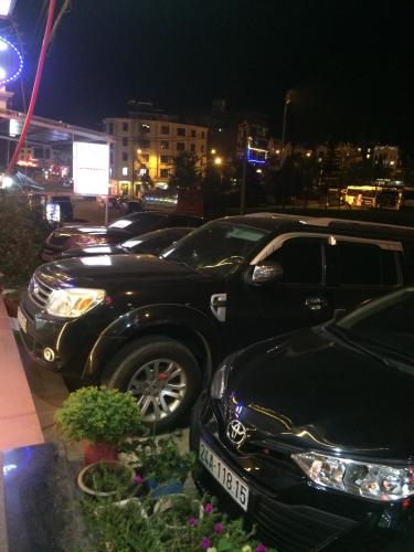 a row of parked cars in a parking lot at night at Minh Hưng Hostel in Sa Pa