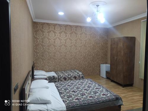 A bed or beds in a room at Simsek hotel