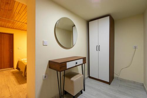 a bathroom with a vanity and a mirror on the wall at Candy Hotel in Istanbul