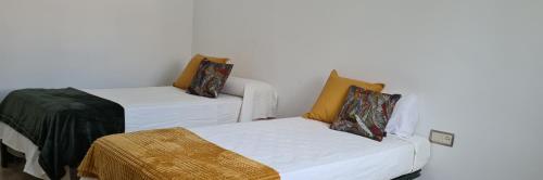 Postel nebo postele na pokoji v ubytování Valencia Green Penthouse
