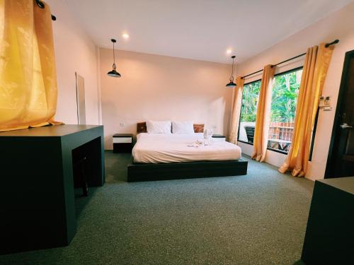 Säng eller sängar i ett rum på ViVi Hotel Resort