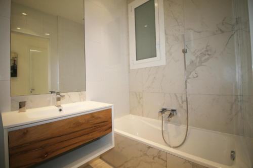 a bathroom with a shower and a sink and a tub at High-End Apartment, Hyper Center, Near The Beaches in Nice