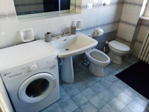 a bathroom with a washing machine and a sink at Le Dimore di Otranto - Altomare in Otranto