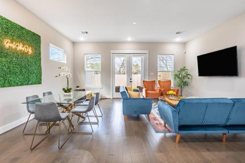 a living room with a blue couch and a table at 3 Bedroom and 3 bath in Houston