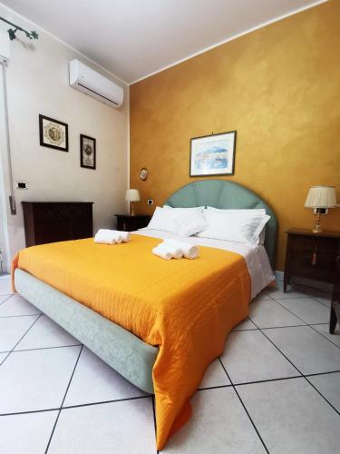 a bedroom with a large bed with towels on it at Nesea Naxos - Sicilian Suite in Giardini Naxos