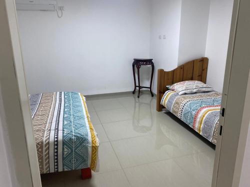 a bedroom with two beds and a tiled floor at Wonderful near Ram lake and Hermon mountain in Mas'ade