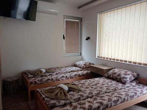 Voodi või voodid majutusasutuse Apartman Oreol toas