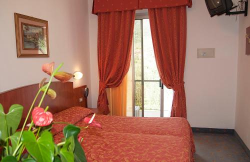 Postel nebo postele na pokoji v ubytování Hotel Garden
