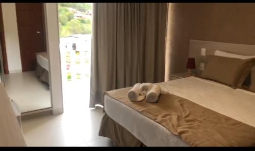 Giường trong phòng chung tại Hotel Fazenda China Park