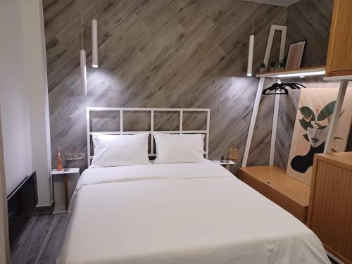 Łóżko lub łóżka w pokoju w obiekcie Sroom Apartment