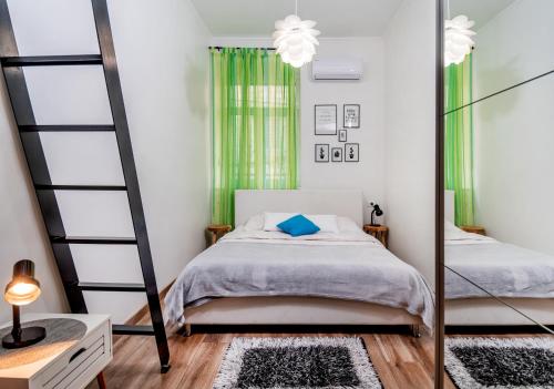Кровать или кровати в номере Apartman Nicoletta
