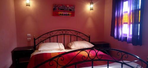 Llit o llits en una habitació de Riad Tifor