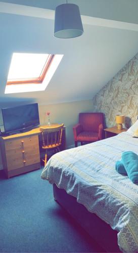 Katil atau katil-katil dalam bilik di Lwr Ormeau Guest House
