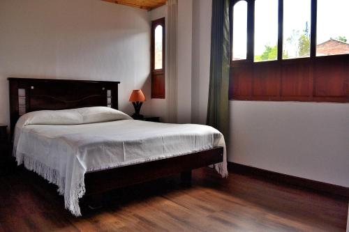 Voodi või voodid majutusasutuse Hotel Itzamana toas