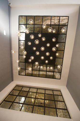a painting of a ceiling in a room with a window at Hotel Boutique Casa Loreta in Querétaro