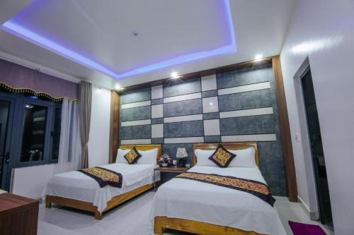 Postel nebo postele na pokoji v ubytování Thuong Hai Hotel