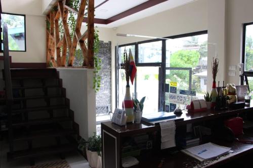 an office with a desk and some windows at V.P. GO INN in Solangon