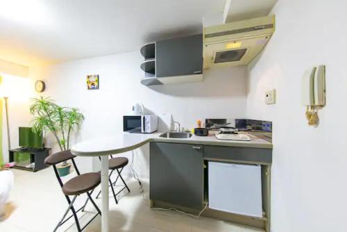 Η κουζίνα ή μικρή κουζίνα στο Apartment Yunagi