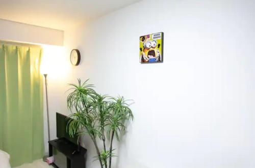 Μια τηλεόραση ή/και κέντρο ψυχαγωγίας στο Apartment Yunagi
