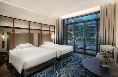 Ένα ή περισσότερα κρεβάτια σε δωμάτιο στο Hotel Indigo Nanjing Garden Expo by IHG