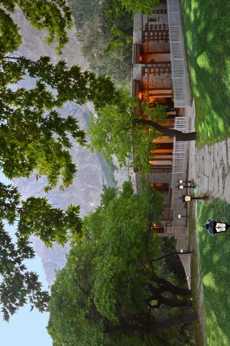 an overhead view of a building on a hill with trees at SERENA ALTIT FORT RESIDENCE in Hunza