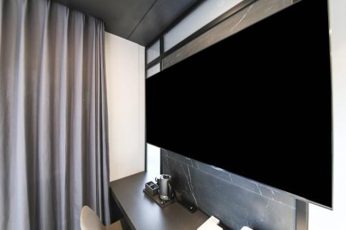 Et tv og/eller underholdning på City Hotel the Busan Metro