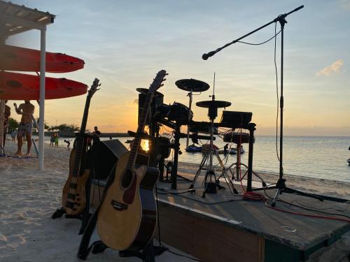a group of guitars and drums on the beach at Lagoona Sunset in Maafushi