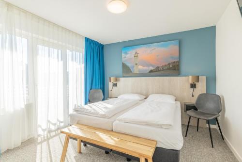 Katil atau katil-katil dalam bilik di Hotel De Koningshof