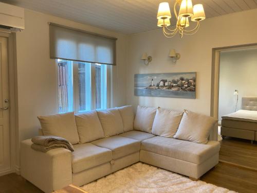 a living room with a couch and a window at Lossi Apartment in Kuressaare