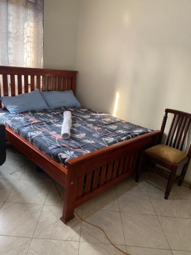 Un ou plusieurs lits dans un hébergement de l'établissement Bukoto suites