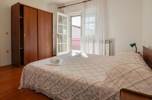 Posteľ alebo postele v izbe v ubytovaní Holiday Apartment Etica