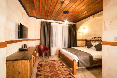 Säng eller sängar i ett rum på Sapphire Stone hotel