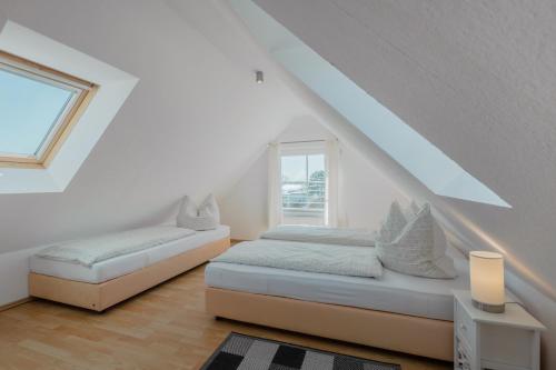 Postelja oz. postelje v sobi nastanitve Ferienhaus Sanddorn Breege- zwischen Bodden & Meer