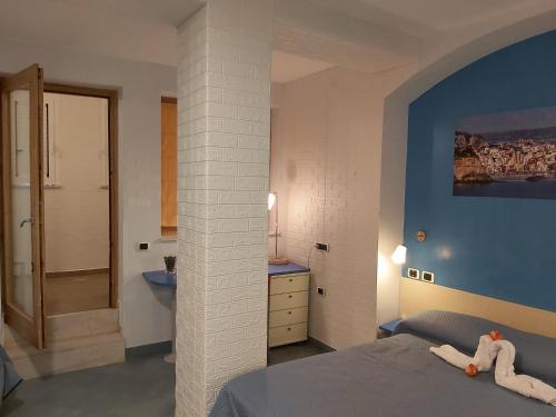Ένα ή περισσότερα κρεβάτια σε δωμάτιο στο Lido Di Procida Guest House