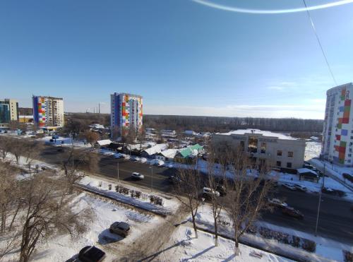 a view of a city with tall buildings at 1 комнатная квартира in Uralsk