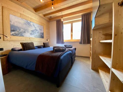 Posteľ alebo postele v izbe v ubytovaní Carosello Lodge Livigno
