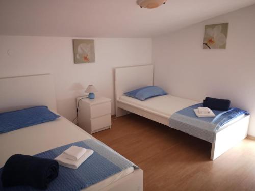 Postel nebo postele na pokoji v ubytování Apartments Tara