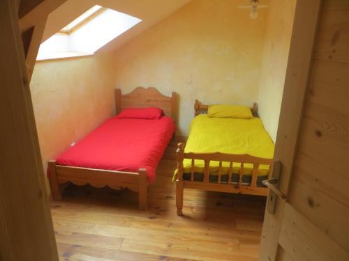 Postel nebo postele na pokoji v ubytování L'Hermitage