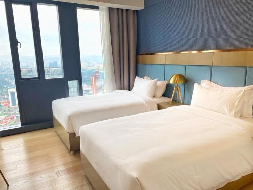 Cama o camas de una habitación en Like Home Star KLCC