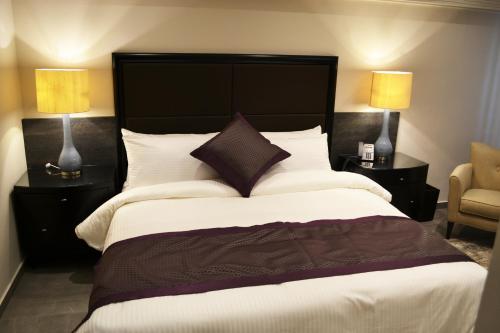 Postel nebo postele na pokoji v ubytování Ambassador, a Boutique Hotel