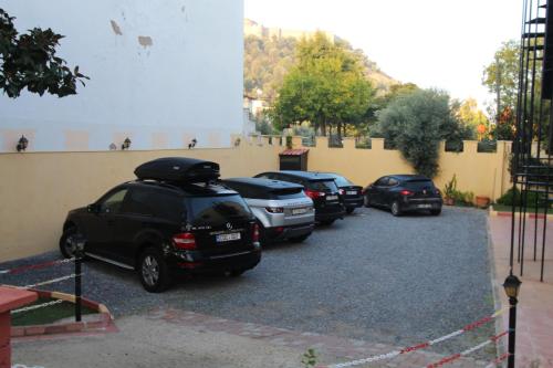 a row of cars parked in a parking lot at Hotel Ave Maria in Selcuk