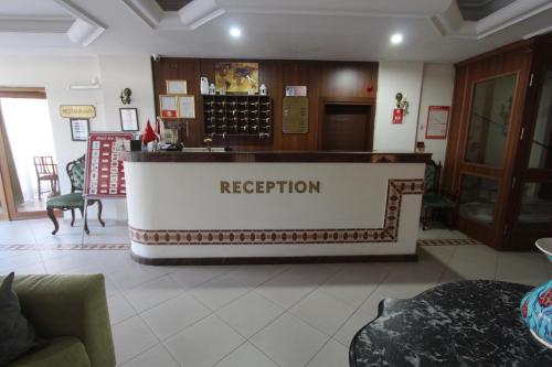a lobby with a reception counter in a building at Hotel Ave Maria in Selcuk