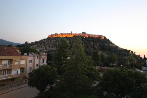 a hill with a castle on top of it at Hotel Ave Maria in Selcuk