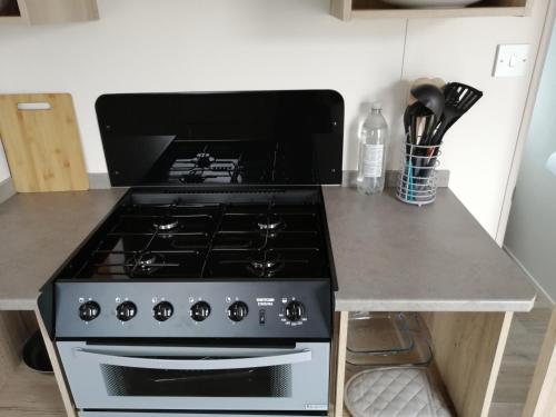 a stove in a kitchen with a counter top at 709 Seawick in Jaywick Sands