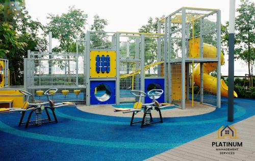 a playground with two chairs and a slide at The Lake-ville KL Jalan Kuching by M Platinum in Kuala Lumpur