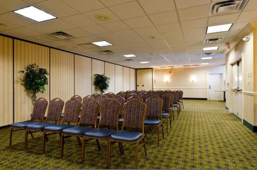 a room with a row of chairs in a room at Motel 6-Frederick, MD - Fort Detrick in Frederick