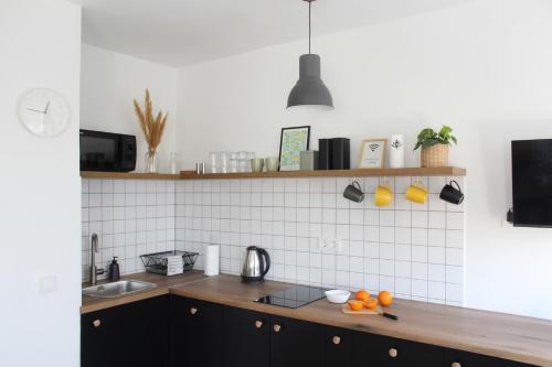 a kitchen with a sink and a counter top at Studio apartman Siget II in Zagreb