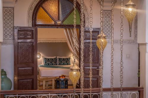 a bedroom with a bed and a large mirror at Riad Kech Soul Boutique & Spa in Marrakech