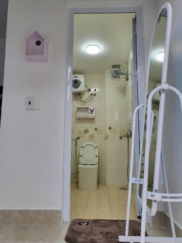 a bathroom with a toilet in a room at BA CON ECH Home and Stay- No 28 lane 259 Nguyen Duc Canh in Hai Phong